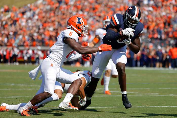 Sep 11, 2021; Charlottesville, Virginia, USA; Virginia Cavaliers tight end Jelani Woods (0) catches a touchdown pass as Illinois Fighting Illini defensive back Tony Adams (6) defends in the first quarter at Scott Stadium. Mandatory Credit: Geoff Burke-USA TODAY Sports
